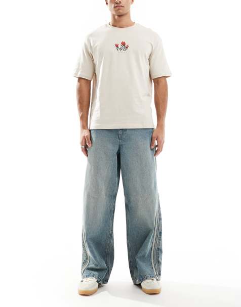 ASOS DESIGN - Superbaggy jeans met sportief detail in mid-wash blauw - view 1