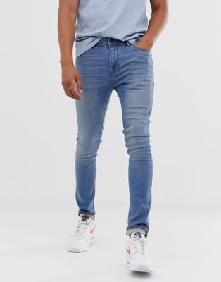 ASOS DESIGN – Superenge Jeans in heller Waschung-Blau