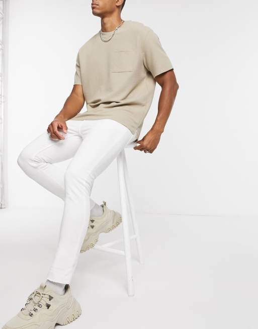 ASOS DESIGN – Superenge Jeans in Weiß mit grobem Saum