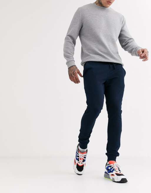 ASOS DESIGN – Superenge Jogginghose in Marineblau