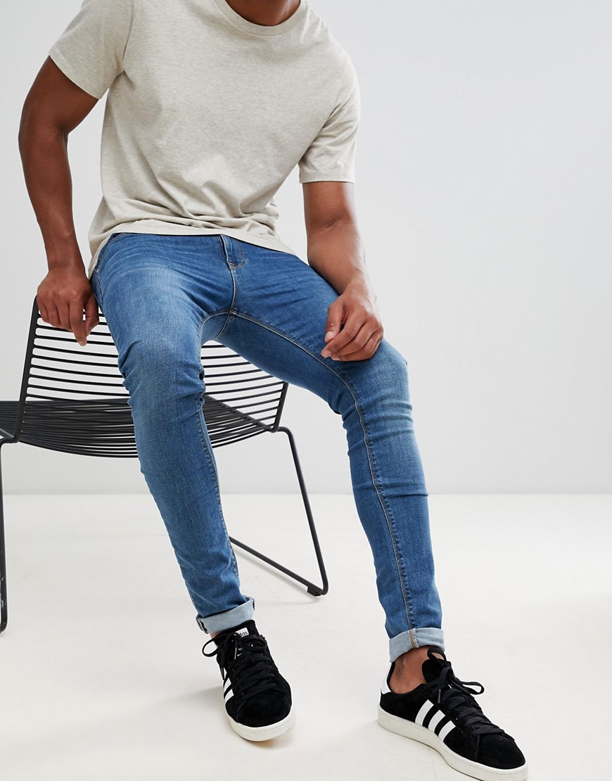 ASOS DESIGN - Superskinny jeans in mid wash-Blauw