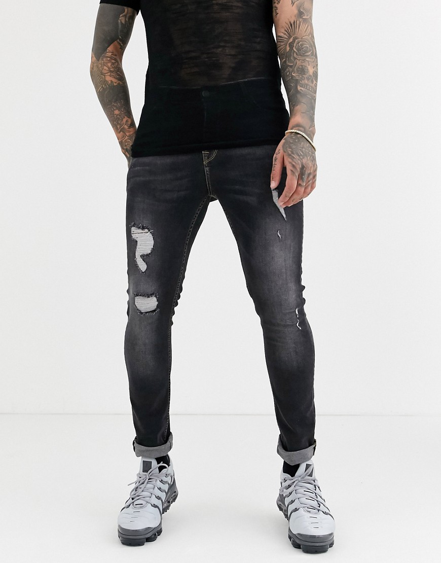 ASOS DESIGN - Superskinny jeans in vintage zwart met wassing en scheuren