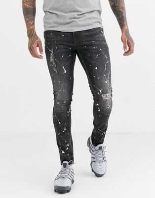 ASOS DESIGN - Superskinny jeans in zwart met wassing met verfspetters