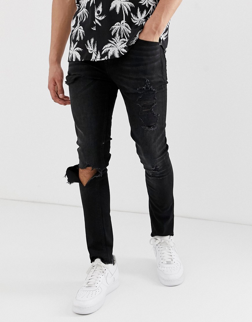 ASOS DESIGN - Superskinny jeans met zwarte wassing en grote scheuren