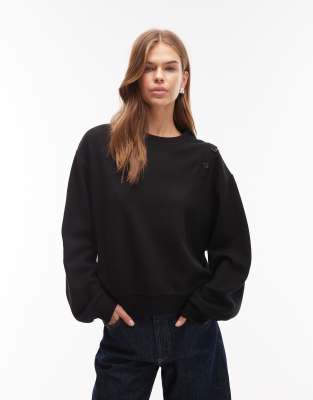 ASOS DESIGN - Superweiches Sweatshirt in Schwarz mit Knopfdetail an der Schulter