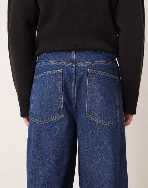 ASOS DESIGN – Superweite Jeans in mittelblauer Waschung mit Seitenstreifen in Khaki, 4 von 5