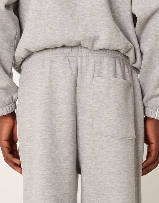 ASOS DESIGN – Superweite Jogginghose in Grau meliert mit seitlicher Paspelierung, Kombiteil, 4 von 5