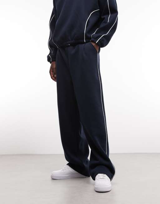 ASOS DESIGN – Superweite Jogginghose in Marineblau mit seitlicher Paspelierung, Kombiteil, 2 von 7