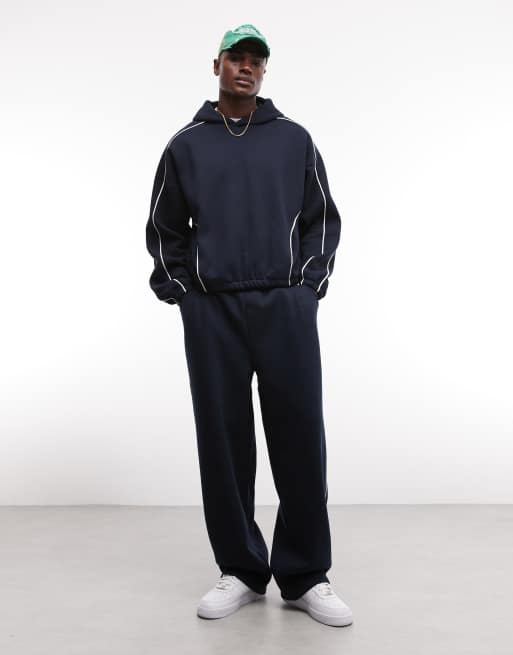 ASOS DESIGN – Superweite Jogginghose in Marineblau mit seitlicher Paspelierung, Kombiteil, 3 von 7