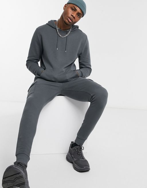 ASOS DESIGN - Survêtement ajusté composé d'un sweat à capuche et d'un  jogger cargo ajusté - Noir délavé