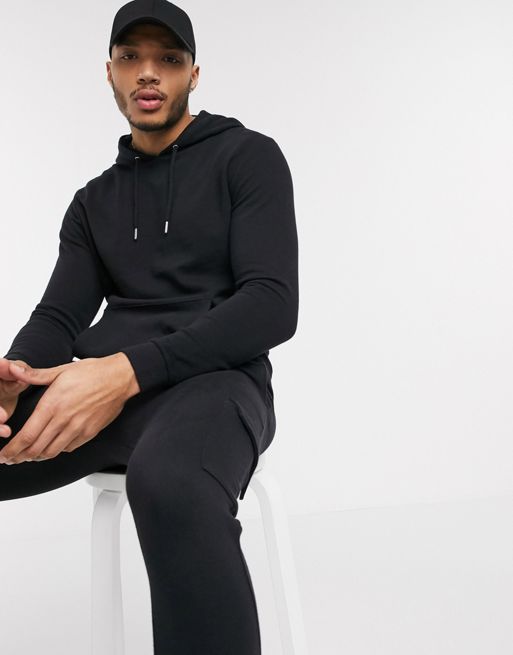 ASOS DESIGN - Survêtement ajusté composé d'un sweat à capuche et d'un  jogger cargo ajusté - Noir délavé