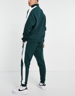 Homme Survêtement oversize avec haut à col zippé et jogger fuselé à bandes latérales - Vert profond