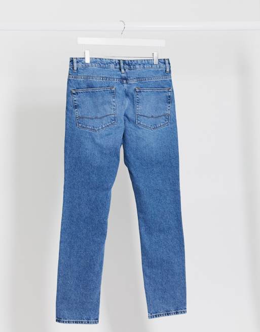 Asos Design Sustainable Schmal Geschnittene Jeans Ohne Stretch Anteil In Mittelblauer Waschung Asos