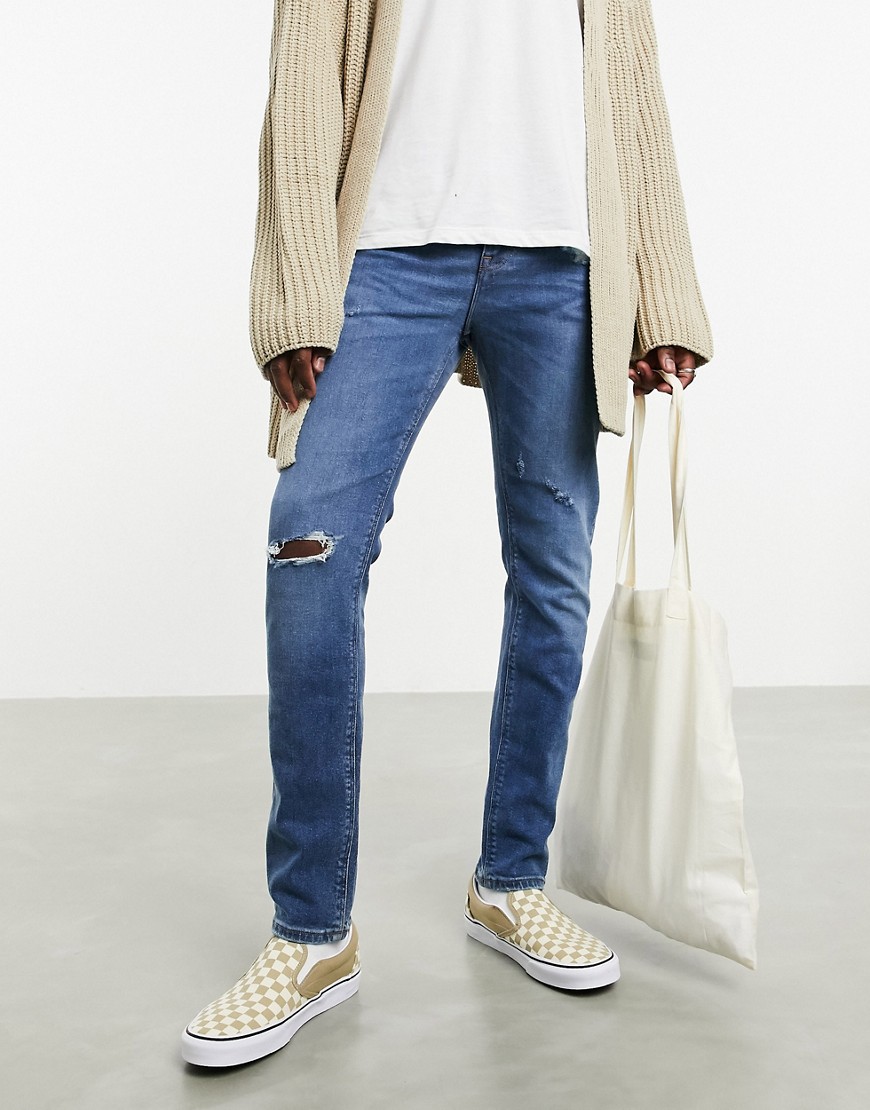 ASOS DESIGN - 'Sustainable' - skinny jeans in mid wash med flænger-Blå