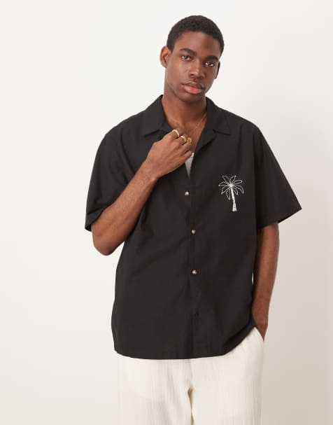 ASOS DESIGN – Svart, avslappnad skjorta med platt krage och palmtryck fram- och baktill - view 1