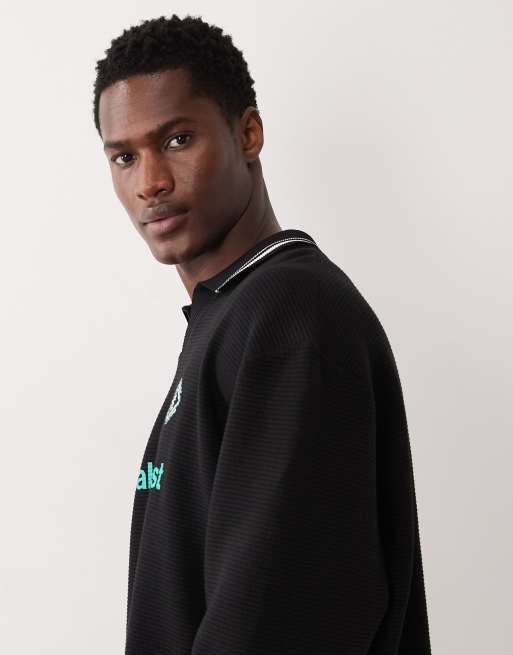 ASOS DESIGN – Svart, avslappnad, strukturerad sweatshirt i rugbystil med pikékrage, 4 av 5