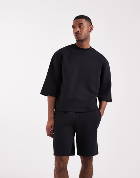 ASOS DESIGN – Svart, avslappnat set med kortärmad sweatshirt och jersey-shorts i lång modell - view 1