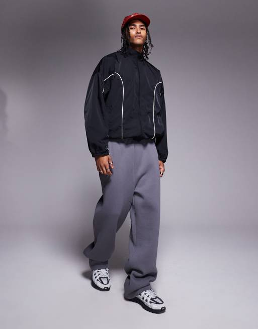 ASOS DESIGN – Svart, oversize träningsjacka med kontrasterande passpoaler, 2 av 4