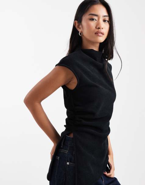 ASOS DESIGN – Svart, ribbad, borstad topp med hög krage och asymmetrisk fåll, del av set - view 1