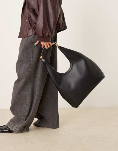 ASOS DESIGN – Svart, rundad toteväska med metalldetaljer på handtaget - view 1
