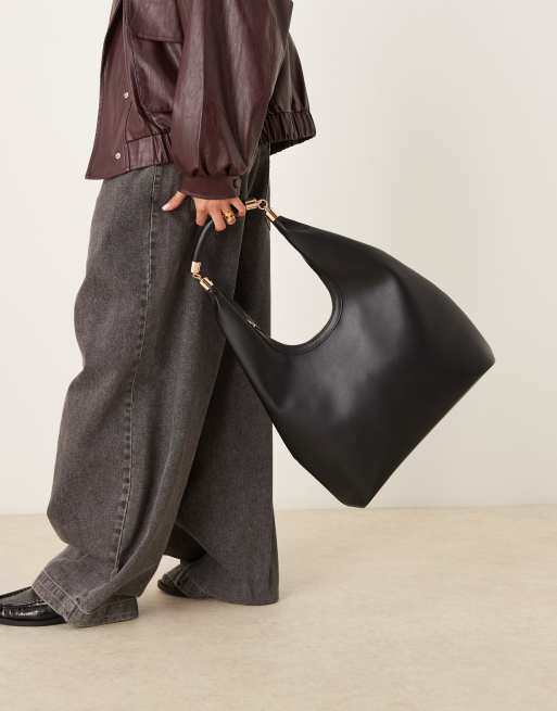 ASOS DESIGN – Svart, rundad toteväska med metalldetaljer på handtaget