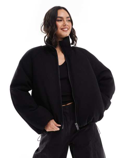 ASOS DESIGN – Svart, stickad pufferjacka med krage - view 1