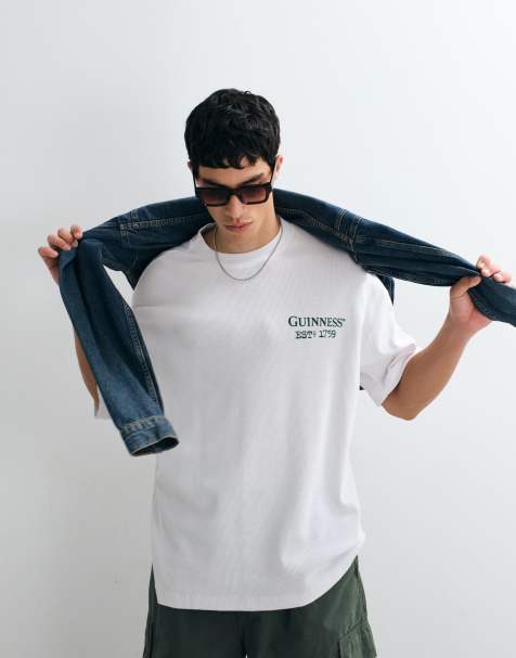 ASOS DESIGN – Svart t-shirt i oversize med Guinness-tryck - view 1