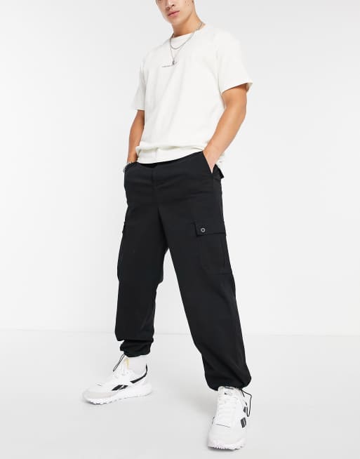 ASOS DESIGN – Svarta avsmalnande cargobyxor i oversize