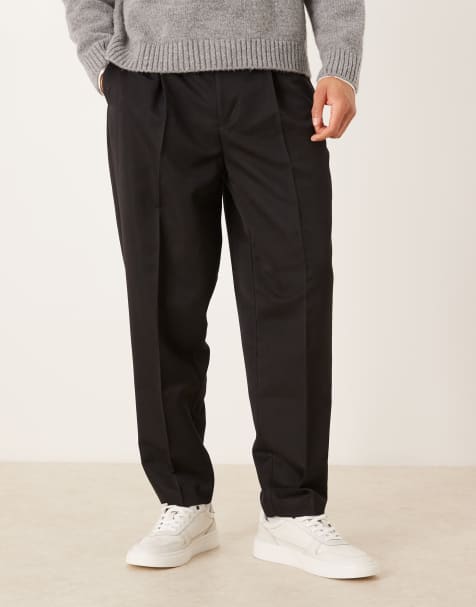 ASOS DESIGN – Svarta, avsmalnande, figursydda byxor i oversize med elastisk midja - view 1