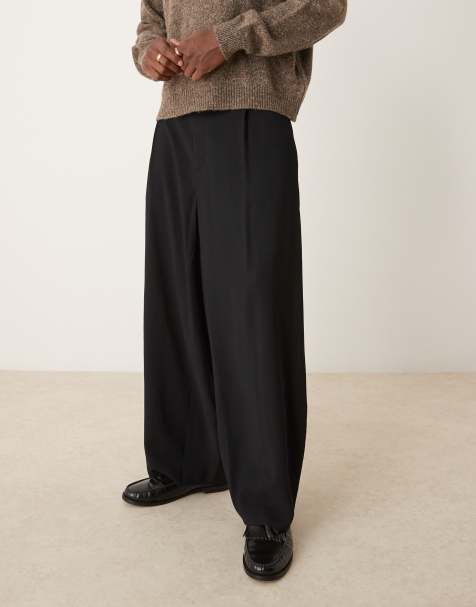 ASOS DESIGN – Svarta, avsmalnande finbyxor med veck framtill - view 1