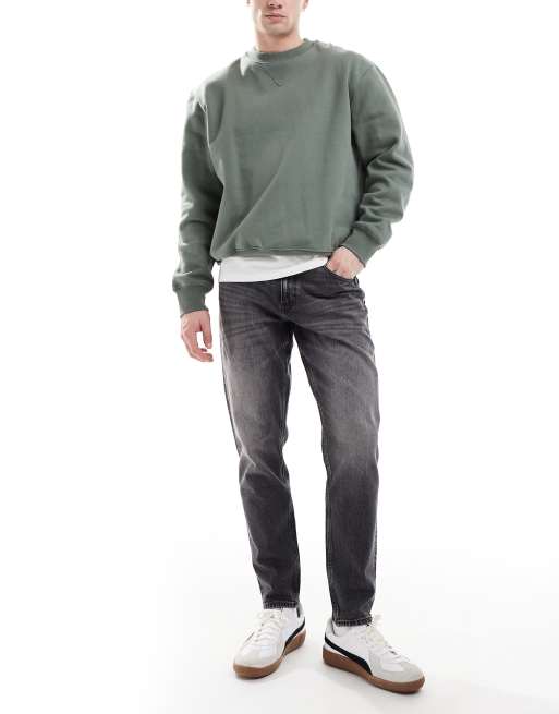 ASOS DESIGN – Svarta, avsmalnande jeans i vintagetvätt med stretch