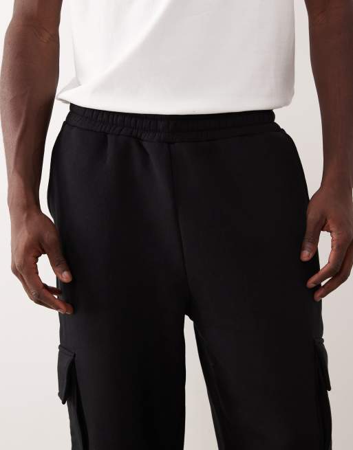 ASOS DESIGN – Svarta, avsmalnande mjukisbyxor i cargostil, 4 av 5