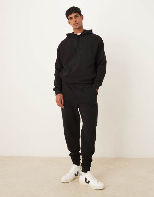 ASOS DESIGN – Svarta, avsmalnande mjukisbyxor med ribbade muddar, del av set, 2 av 5