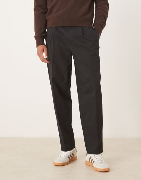 ASOS DESIGN – Svarta, avsmalnande, oversize finbyxor i 100% bomull - view 1