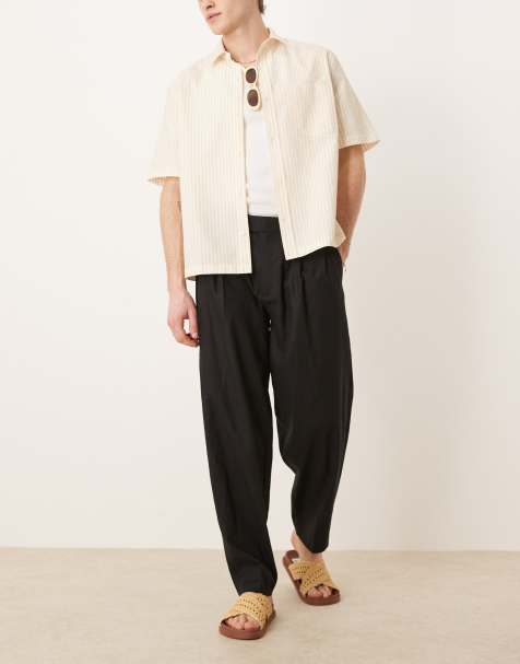 ASOS DESIGN – Svarta, avsmalnande, oversize finbyxor i linneblandning med veck framtill - view 1