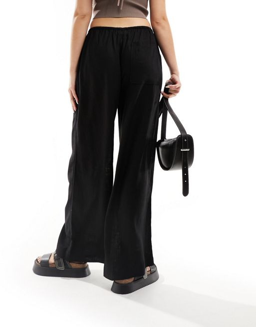 ASOS DESIGN – Svarta byxor av linnemix med vida ben i dra på-stil