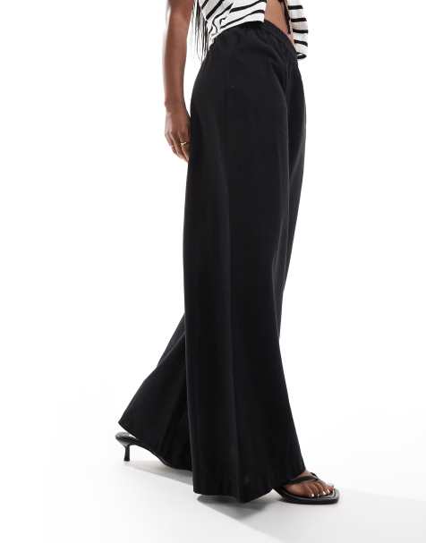 ASOS DESIGN – Svarta, diagonalskurna byxor i linnelook med avslappnad passform - view 1