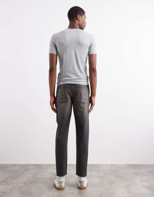 ASOS DESIGN – Svarta, gultonade, tvättade jeans med avsmalnande passform, 2 av 5