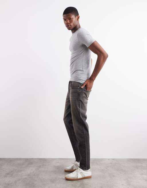 ASOS DESIGN – Svarta, gultonade, tvättade jeans med avsmalnande passform, 3 av 5