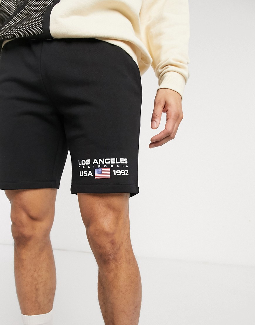 ASOS DESIGN – Svarta shorts med extra smal passform och Los Angeles-tryck