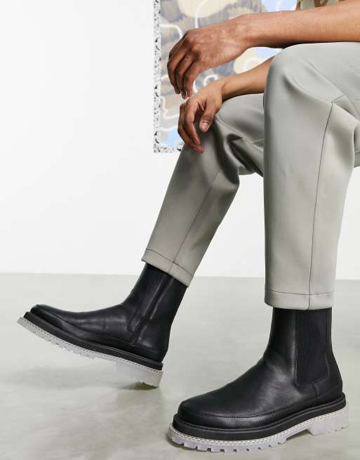 ASOS DESIGN – Svarta vadhöga chelseaboots i läderimitation med genomskinlig tjock sula