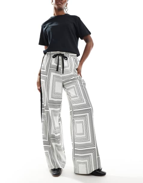 ASOS DESIGN – Svartvita byxor med elastisk midja, geometriskt mönster och kontrasterande panel - view 1