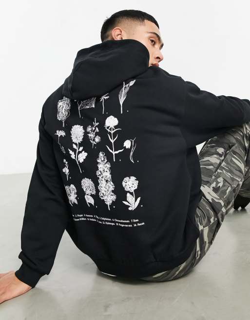 ASOS DESIGN - Sweat à capuche oversize avec imprimé floral linéaire devant et au dos - Noir