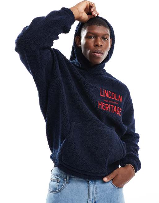 ASOS DESIGN - Sweat à capuche oversize en imitation peau de mouton imprimée - Bleu marine 