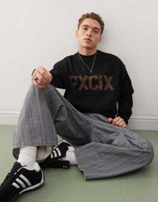 ASOS DESIGN - Sweat avec imprimé lettres à motif guépard - Noir