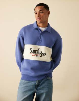 ASOS DESIGN - Sweat col polo à empiècement contrasté et imprimé - Bleu