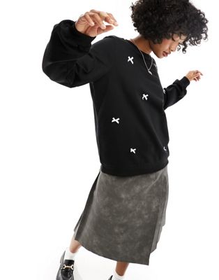 ASOS DESIGN oversized sweatshirt with bows in black - ASOS Price Checker