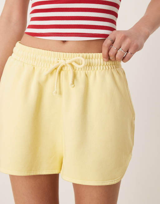 ASOS DESIGN sweat runner shorts in washed lemon