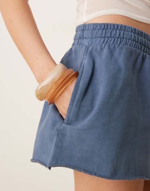 ASOS DESIGN sweat shorts in with raw hem detail in washed blue
