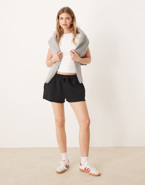 ASOS DESIGN sweatshirt fabric shorts with raw hem detail in black - view 1